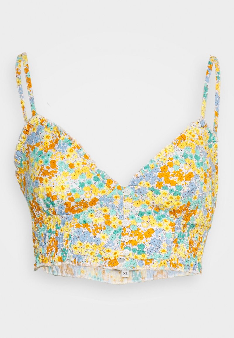 Camisole courte à fleurs avec des fleurs jaunes, orange, bleues et vertes, boutonnée à l'avant, bretelles fines ajustables et côtés froncés en taille XS.