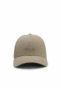 Tan baseball cap made of cotton, featuring a curved brim, stitched logo "BOSS" on the front, and a classic six-panel design.