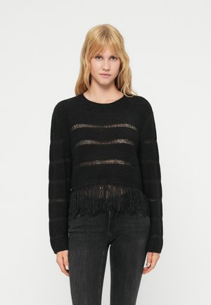 Fekete, rövidített pulóver vízszintes, áttetsző csíkos mintával és bojtokkal a szegélyén. Texturált kötött anyagból készült, hosszú ujjú és kerek nyakú.