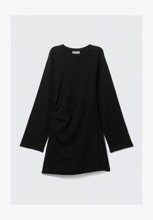 Schwarzes Langarmoberteil mit Rundhalsausschnitt, drapiertem Seitendetail und lässiger Passform. Aus weichem Stoff gefertigt, mit minimalen Nähten und ohne Muster.