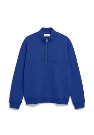Blue fleece pullover with a high collar and half zip closure. Features a solid texture and a horizontal seam detail across the chest.
