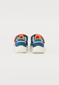 Blue athletic shoes with orange accents and textured straps. White rubber soles with textured grip, mesh sections for breathability.