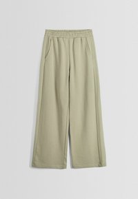 Ljust gröna vida byxor i mjukt tyg med elastisk midja och två sidofickor, med en slät yta och avslappnad passform.