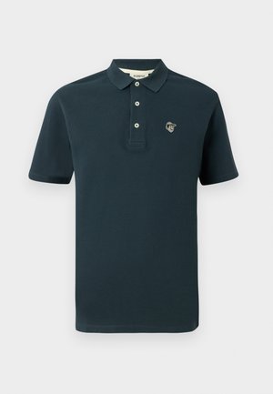Polo de culoare bleumarin închis, fabricat din bumbac, cu un guler clasic, placket cu trei butoane și un mic logo brodat pe piept.