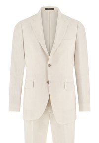 Costume homme couleur crème avec revers crantés, fermeture à deux boutons, poches à rabat et pantalon assorti.