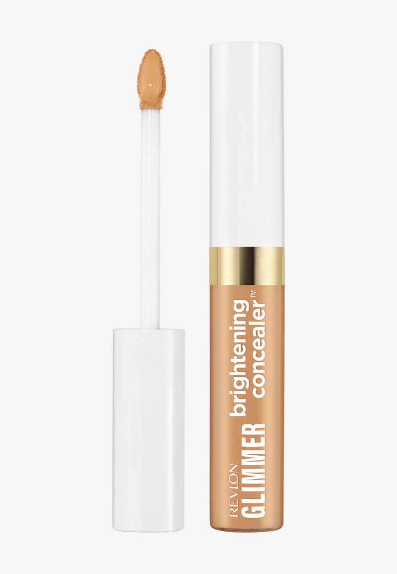 Correcteur illuminateur Revlon Glimmer avec capuchon blanc et doré, applicateur avec un embout de correcteur beige.