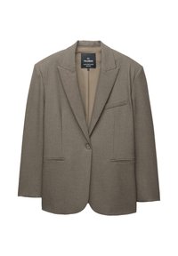Blazer marron avec des épaules structurées, fermeture à un bouton et revers crantés. Dispose de deux poches avant et d'une doublure intérieure lisse.