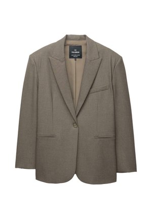 Blazer marrone con spalle strutturate, chiusura a singolo bottone e rever a punta. Presenta due tasche frontali e una fodera interna liscia.