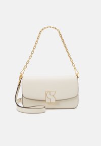 Cream leather handbag with a gold chain strap, featuring a geometric clasp and contrasting dark piping along the edges.