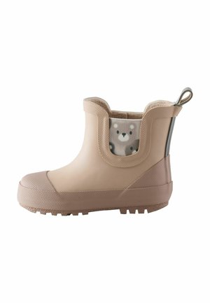 Beige waterproof ankle boots with textured rubber sole, elastic side panels, and inner lining featuring a bear pattern. Includes a pull tab.