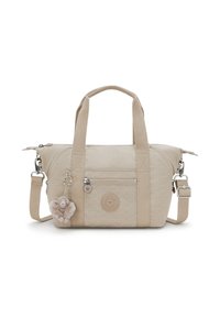 Beige Handtasche mit doppelten Griffen und verstellbarem Schulterriemen, ausgestattet mit einem strukturierten Muster, einer Reißverschlussfronttasche und einem flauschigen Affenanhänger.