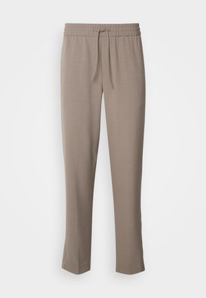 Light brown trousers with an elastic waistband and drawstring. Tapered legs with a smooth texture and no visible patterns or accents.