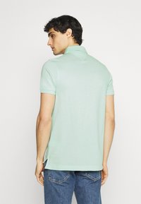 Tommy Hilfiger Polo - oxygen