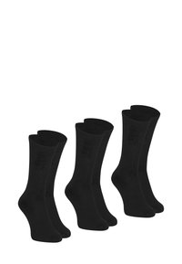 Ensemble de trois paires de chaussettes noires montantes. Fabriquées à partir d'un matériau doux et extensible avec une texture lisse. Renforts au talon et aux orteils.