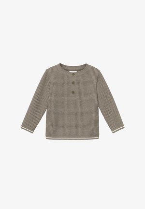 Chemise pour tout-petit à manches longues en tricot texturé beige avec trois boutons au col et bordure blanche aux poignets et à l'ourlet.