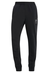 Schwarze Sweatpants aus weichem Material, mit einem elastischen Bund mit Kordelzug, Seitentaschen und einem kleinen Logo an der linken Oberschenkelseite.