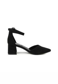 Pumps nere in suede con cinturino alla caviglia, punta affusolata e tacco a blocco. Presentano un cinturino sicuro alla caviglia e una texture liscia.