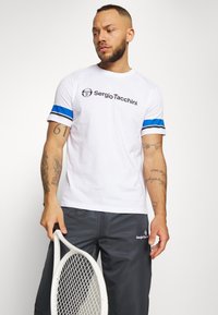 Sergio Tacchini CARSON - Calças de fato de treino - ebony/white