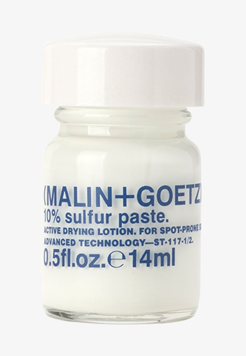 Weißes Glasgefäß mit glänzendem weißen Deckel, etikettiert mit blauer Schrift, die 10% Schwefelpaste für zu Unreinheiten neigende Haut angibt. Volumen: 0,5 fl oz.