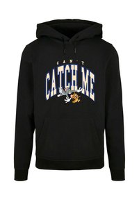 Svart hettegenser med frontlomme, med grafisk tekst "KAN'T CATCH ME" i blått og hvitt, samt tegneseriefigurer av Tom og Jerry.