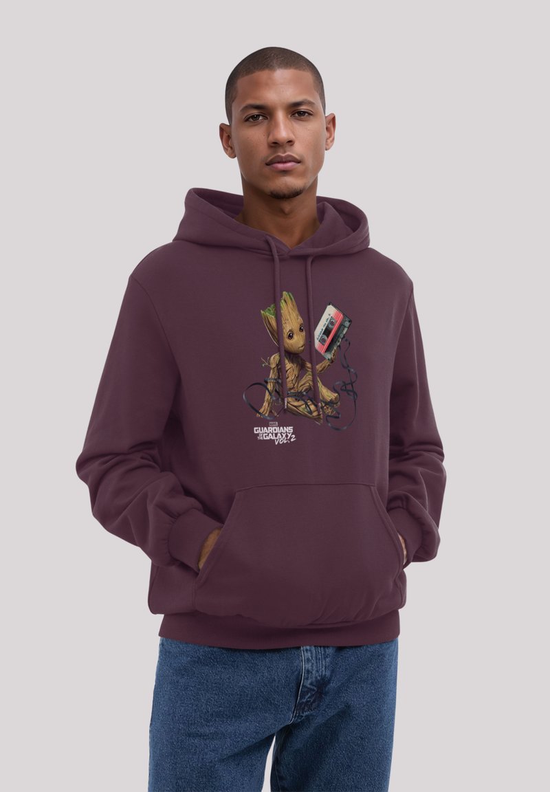 Maroon hoodie with drawstring, featuring a graphic of a Groot character holding a cassette tape. Soft material, relaxed fit.