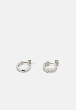 Silver hoop earrings with a textured surface featuring a floral pattern, designed with a post and butterfly clasp closure.