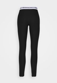 Svarta leggings i stretchigt material, med ett brett vitt midjeband som har logotekst och en slim fit längs benen.
