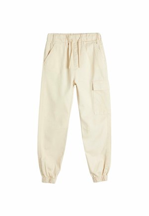 Beige cargobukser lavet af bomuld, med elastisk talje, sidelommer og en enkelt cargolomme på det højre ben. Elastiske manchetter.