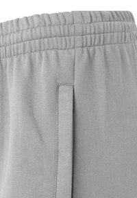 Grijze sweatpants zijn voorzien van een elastische tailleband, een zachte textuur en een zijvak, ontworpen voor comfort en casual dragen.
