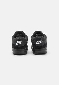 Jordan JORDAN 4 RM UNISEX - Sneaker low - black/white