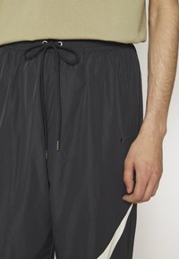 Nike Sportswear PANT - Joggebukse - black/coconut milk