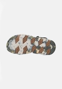 Shoe outsole with a multi-colored pattern in grey, brown, and green. Features a hexagonal grip design and textured surfaces for traction.
