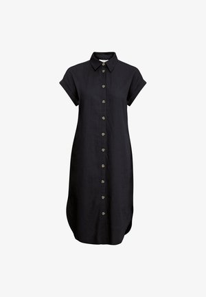 Mustast linast triiksärgidressist lühikeste rullitud varrukatega, nööpide ees, ja kaarjas hem, millel on dekoratiivsed messingist nööbid pihikute ääres.