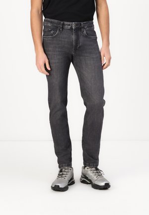 Gray denim jeans with a straight fit, five-pocket design, and contrasting stitching. Paired with gray athletic shoes and a black shirt.