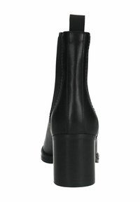 Bottines en cuir noir avec une texture lisse, des panneaux latéraux élastiques et un talon empilé. Elles sont dotées d'une languette à l'arrière.