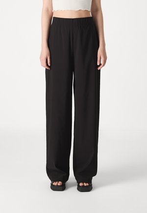 Black wide-leg pants with an elastic waistband, made from a lightweight fabric, feature a smooth texture and a relaxed fit.