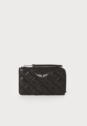Black quilted leather wallet with zipper closure and silver wing-shaped logo on front against white background.