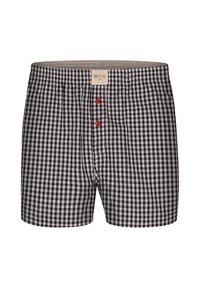 Boxer in fantasia a scacchi navy e bianco con elastico grigio, caratterizzati da due bottoni rossi frontali e un'etichetta del marchio al centro in alto.