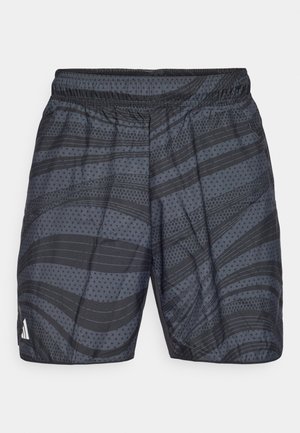 Črne športne kratke hlače s patterned oblikovanjem, ki vključuje horizontalne črte in pikice. Elastičen pas in majhna značka na levi strani.