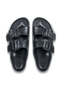 Black sandals with two adjustable straps, featuring buckles. Made of smooth material with a contoured footbed and textured sole for grip.
