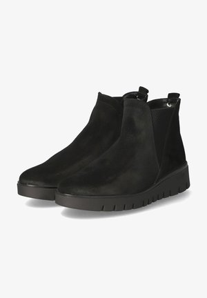 Black suede ankle boots with a textured side panel, pull tabs, and a thick rubber sole featuring a ridged pattern.
