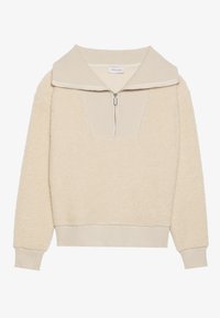 Pullover beige in pile con colletto con zip e dettagli a costine. Presenta una superficie testurizzata e una vestibilità rilassata, adatto per l'abbigliamento casual.