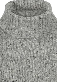 Grey sweater with a high ribbed collar. Made from textured wool blend, featuring a speckled pattern with black and white accents.