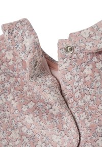 Pink floral-patterned fabric with muted cream and blue accents, featuring a collared neckline and snap closures. Soft, textured material.