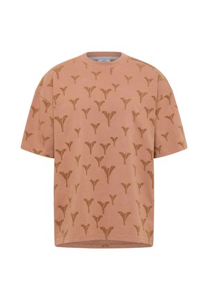 Pink cotton oversized t-shirt featuring a repeated brown abstract pattern, ribbed crew neck, and short sleeves.