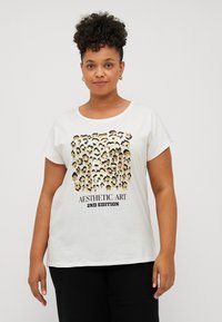 White cotton t-shirt featuring a leopard print design in gold and black, with "Aesthetic Art 2nd Edition" text below the graphic.