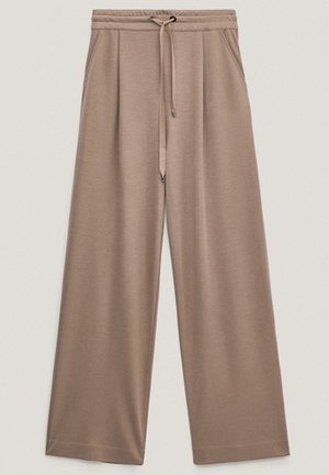 Pantaloni beige a gamba larga e vestibilità morbida, con vita elastica e coulisse, dotati di tasche laterali e tessuto dalla texture liscia.