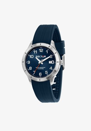 Orologio con cinturino in gomma blu navy, cassa in acciaio inossidabile, quadrante blu, numeri arabi bianchi, dettagli argentati e finestra per la visualizzazione della data.