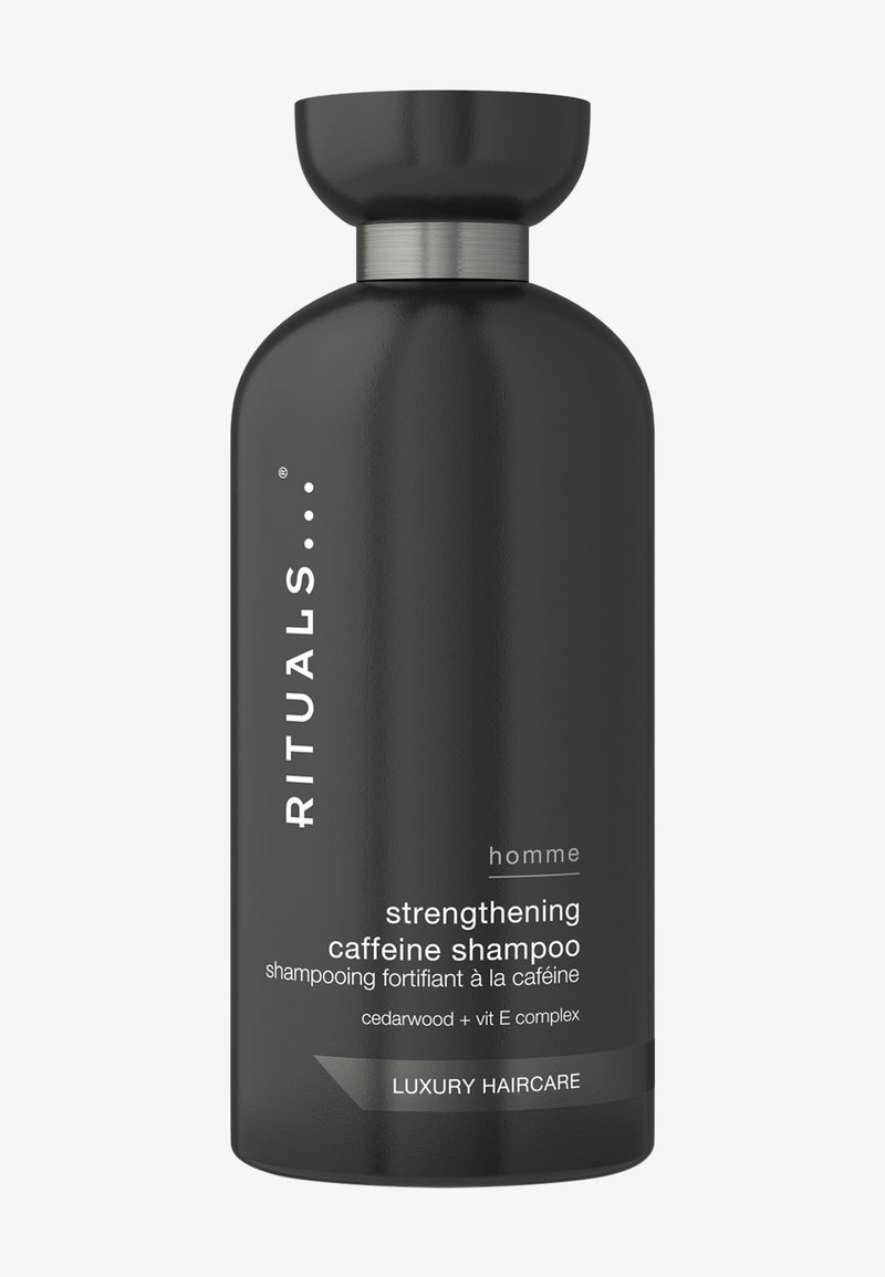 Flacone di shampoo cilindrico nero con un tappo arrotondato. Accento in metallo argentato sul collo. Testo bianco che etichetta i dettagli del prodotto e gli ingredienti.