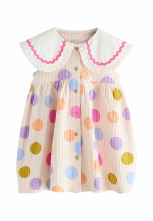 Cream toddler dress with multicolored polka dots, wooden buttons down front, and large white collar with pink wavy trim.
